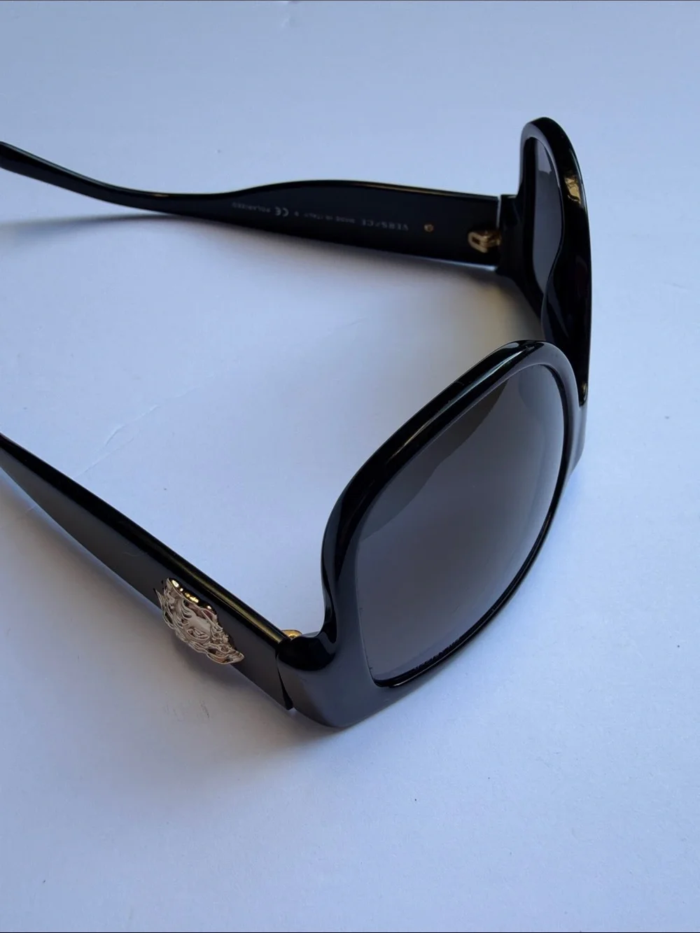 Versace questions leave